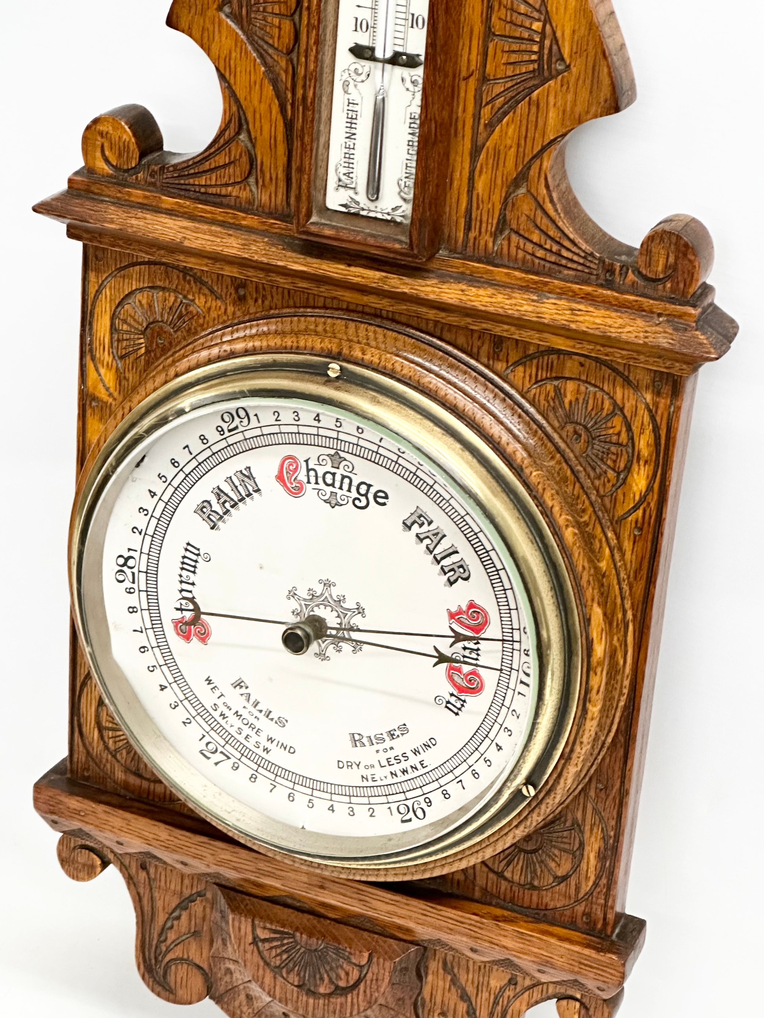 A Victorian carved oak barometer. 28x84cm W - Image 4 of 5