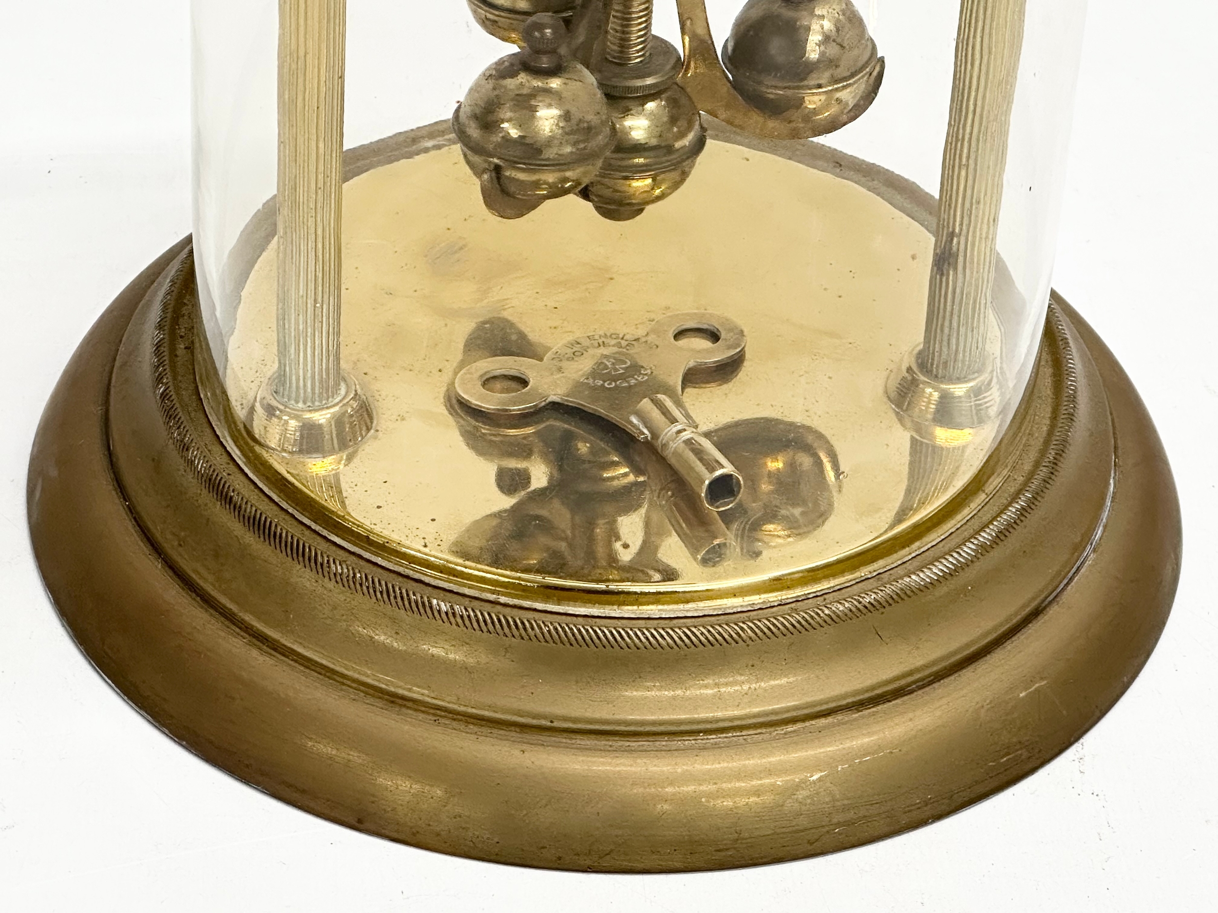 An Early/Mid 20th Century brass anniversary clock with key. 18x26cm - Image 2 of 5