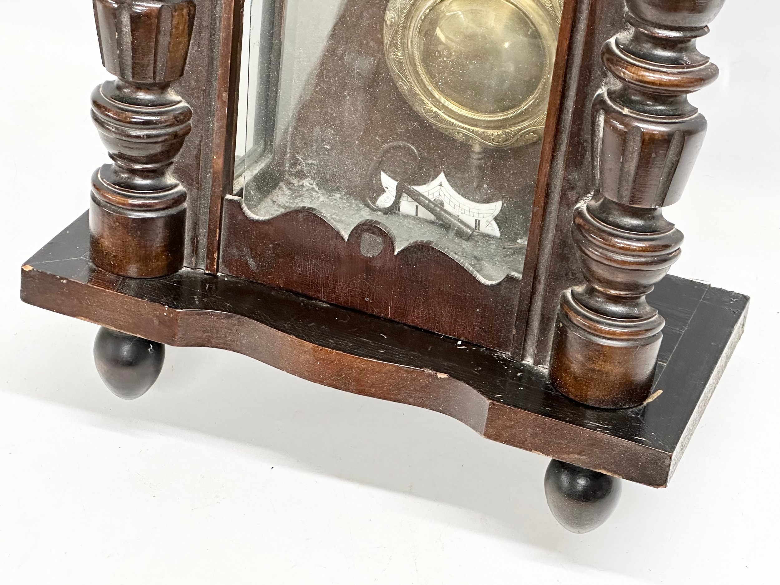 A Late 19th Century Victorian mahogany Vienna wall clock. With key and pendulum. 42x64cm - Image 2 of 5