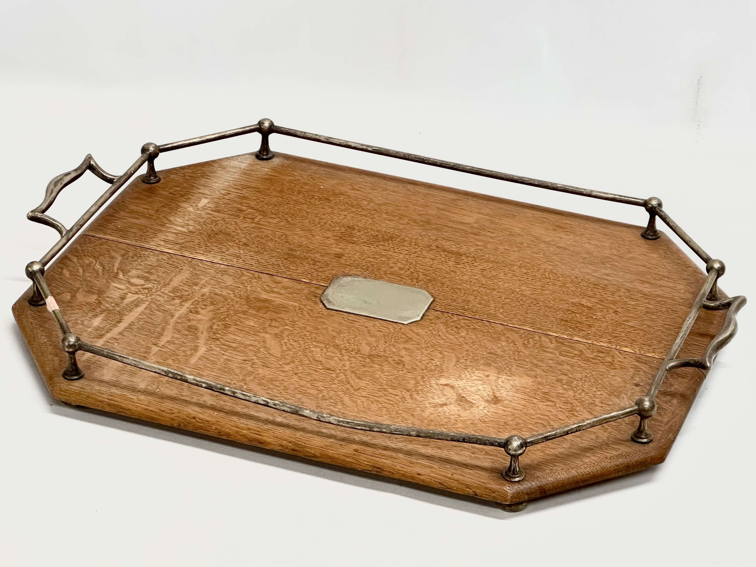 An Early 20th Century oak and silver plated serving tray. Circa 1910-1920. 55x50x7cm