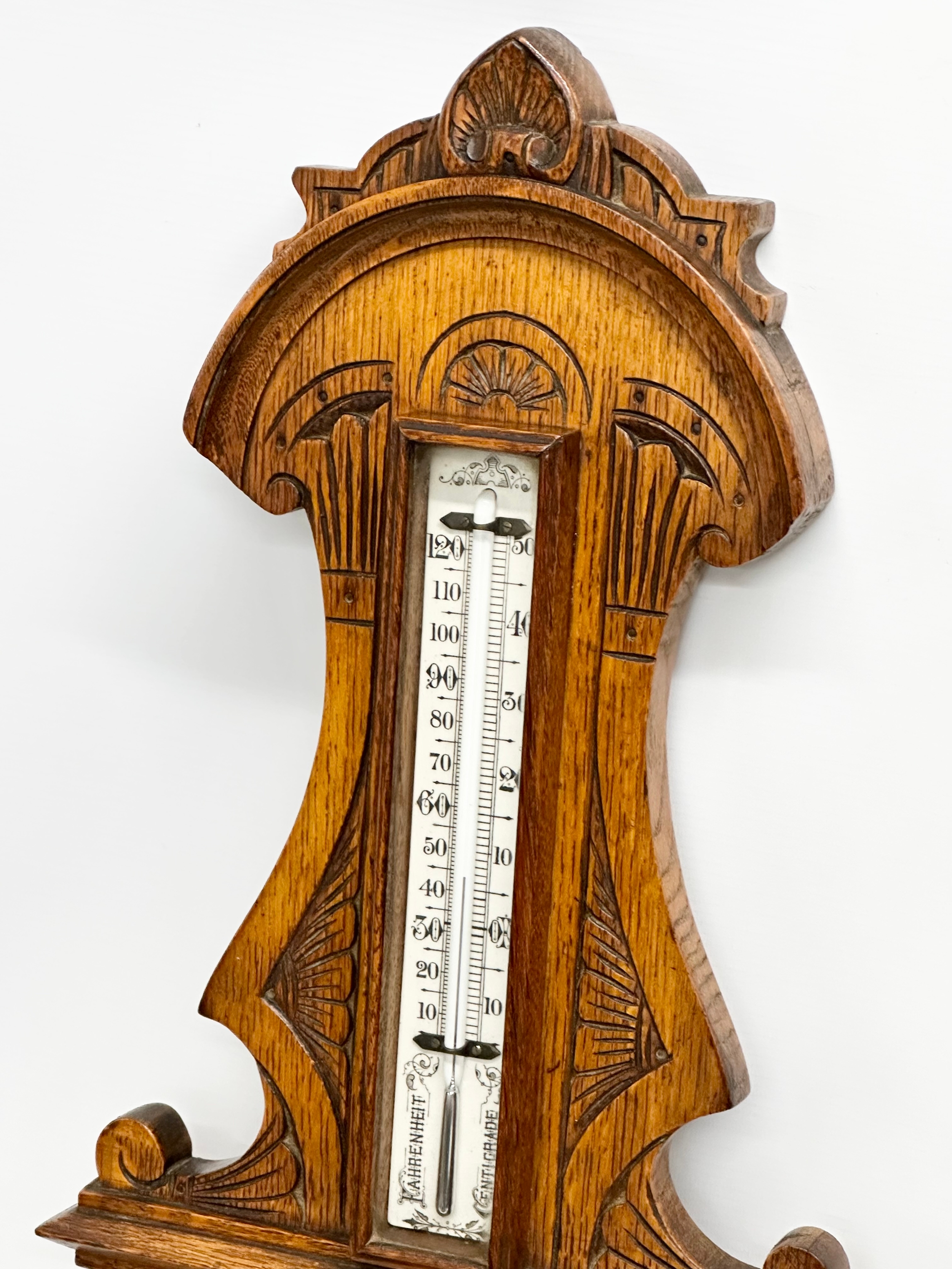 A Victorian carved oak barometer. 28x84cm W - Image 5 of 5