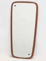 A 1960’s Mid Century teak framed mirror. 34x73cm