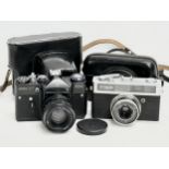 2 vintage cameras. A Zenit EM camera with case and a Canon Canonet Junior camera with case.