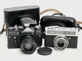 2 vintage cameras. A Zenit EM camera with case and a Canon Canonet Junior camera with case.