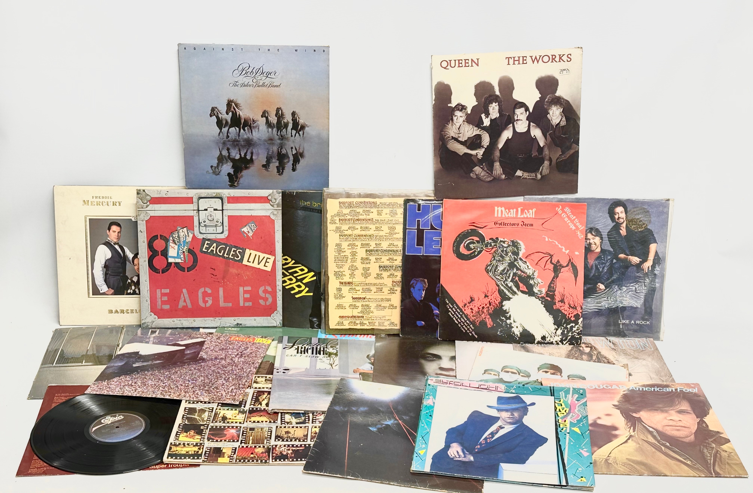 A collection of LP, vinyl records. Meatloaf, The Eagles, Elton John, Tina Turner, Billy Joel,