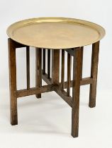 A St Dunstan’s War Blinded Soldier oak framed folding table with brass top. 50x50cm