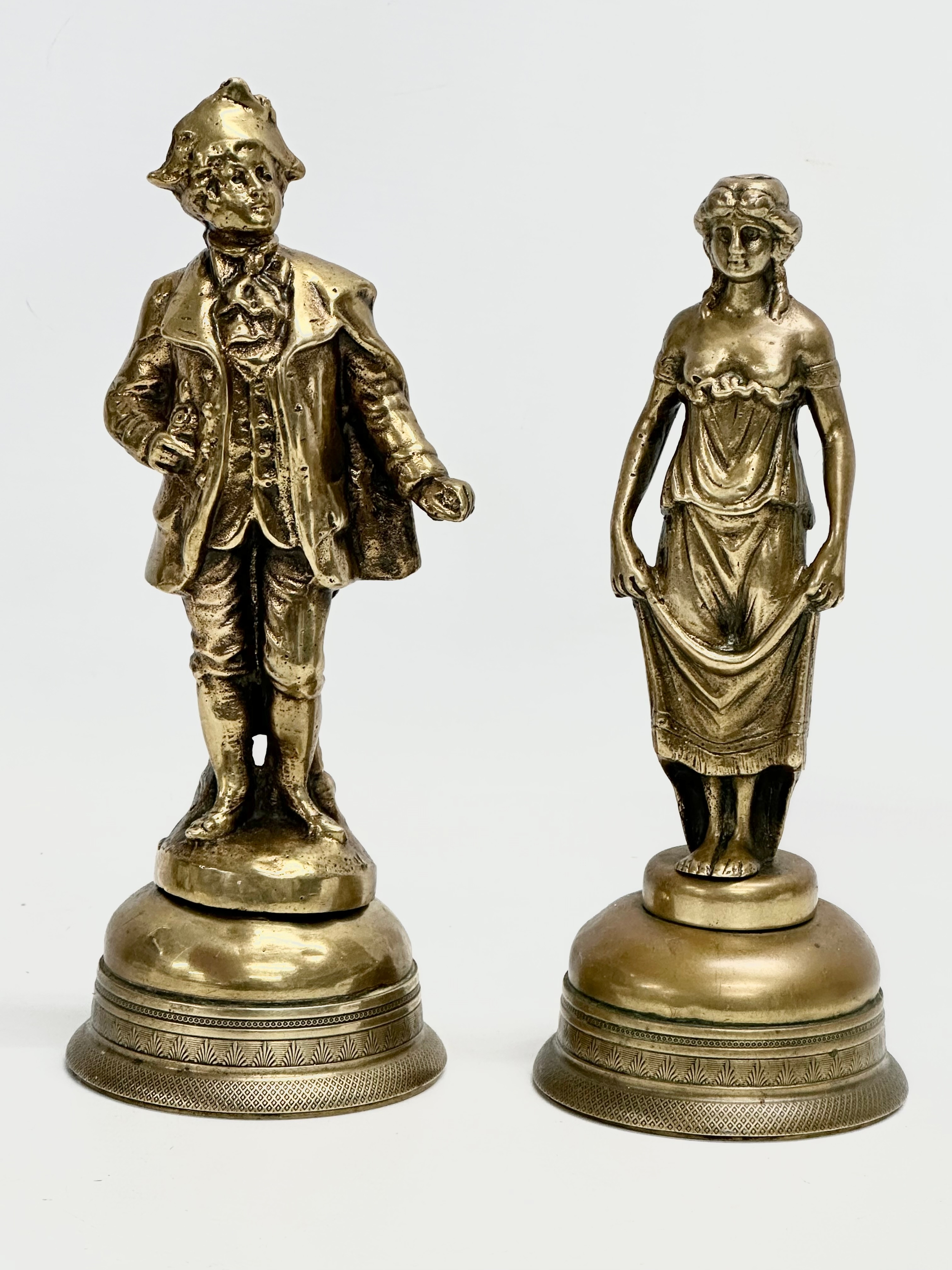 A pair of Late 19th Century brass figurines. 22cm