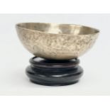 A Late 19th Century Tibetan Singing bowl on stand. Bowl measures 16x6cm