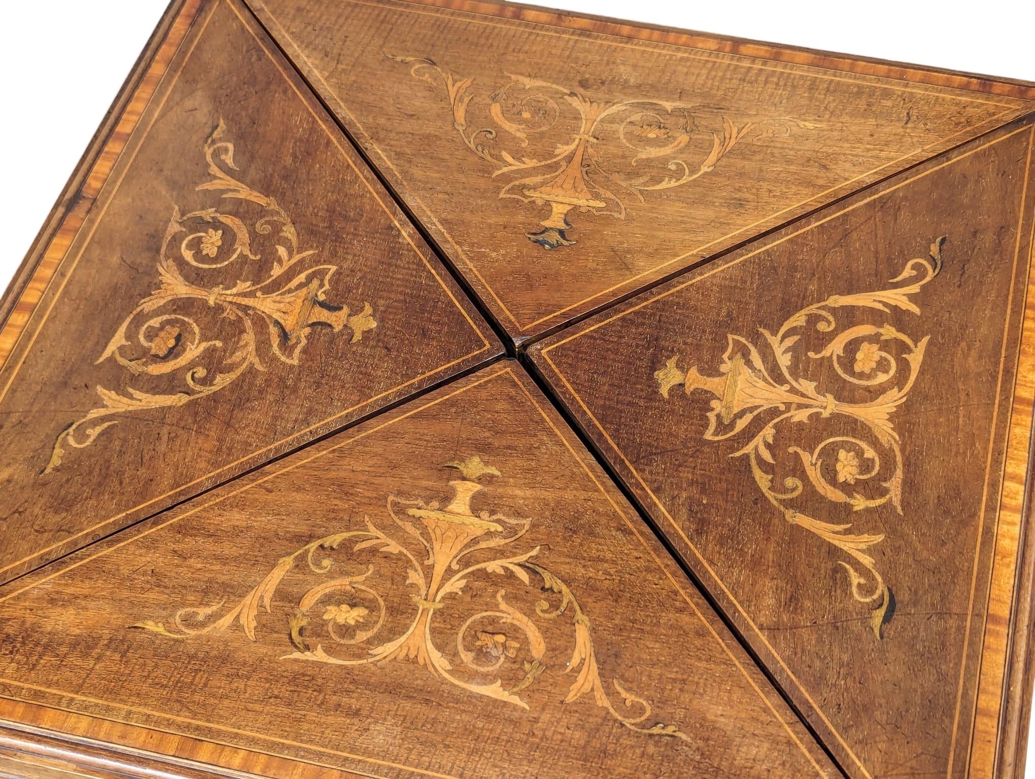 An Edwardian inlaid mahogany envelope turnover games table. 53.5x77.5cm - Image 6 of 8