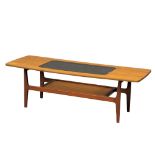 A Mid Century teak 2 tiered coffee table with smoked glass. 136x50x43cm