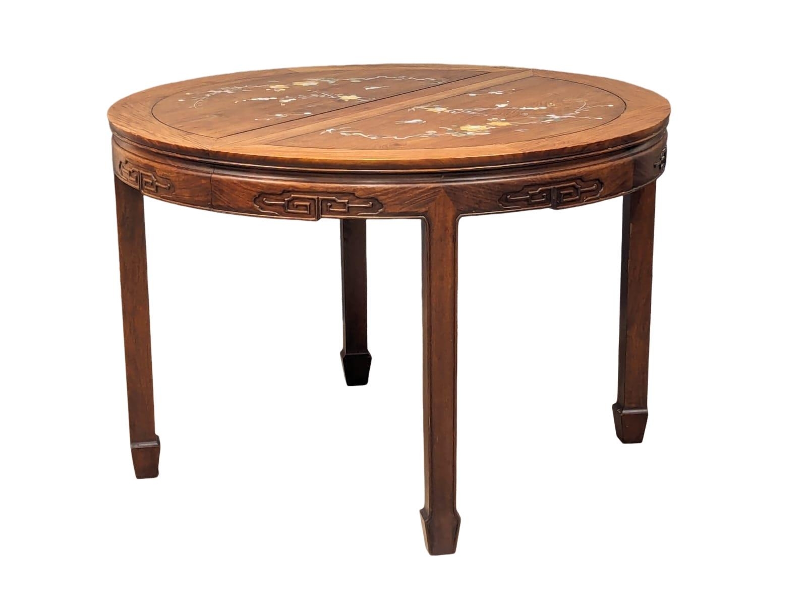 A Chinese rosewood 2 leaf extending dining table and 6 chairs with Mother of Pearl inlay. - Image 4 of 11