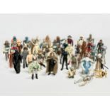 A collection of 1970’s/80’s Star Wars action figures and weapons.