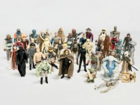 A collection of 1970’s/80’s Star Wars action figures and weapons.