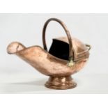 A Victorian copper coal scuttle. 32x57cm