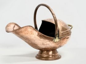 A Victorian copper coal scuttle. 32x57cm