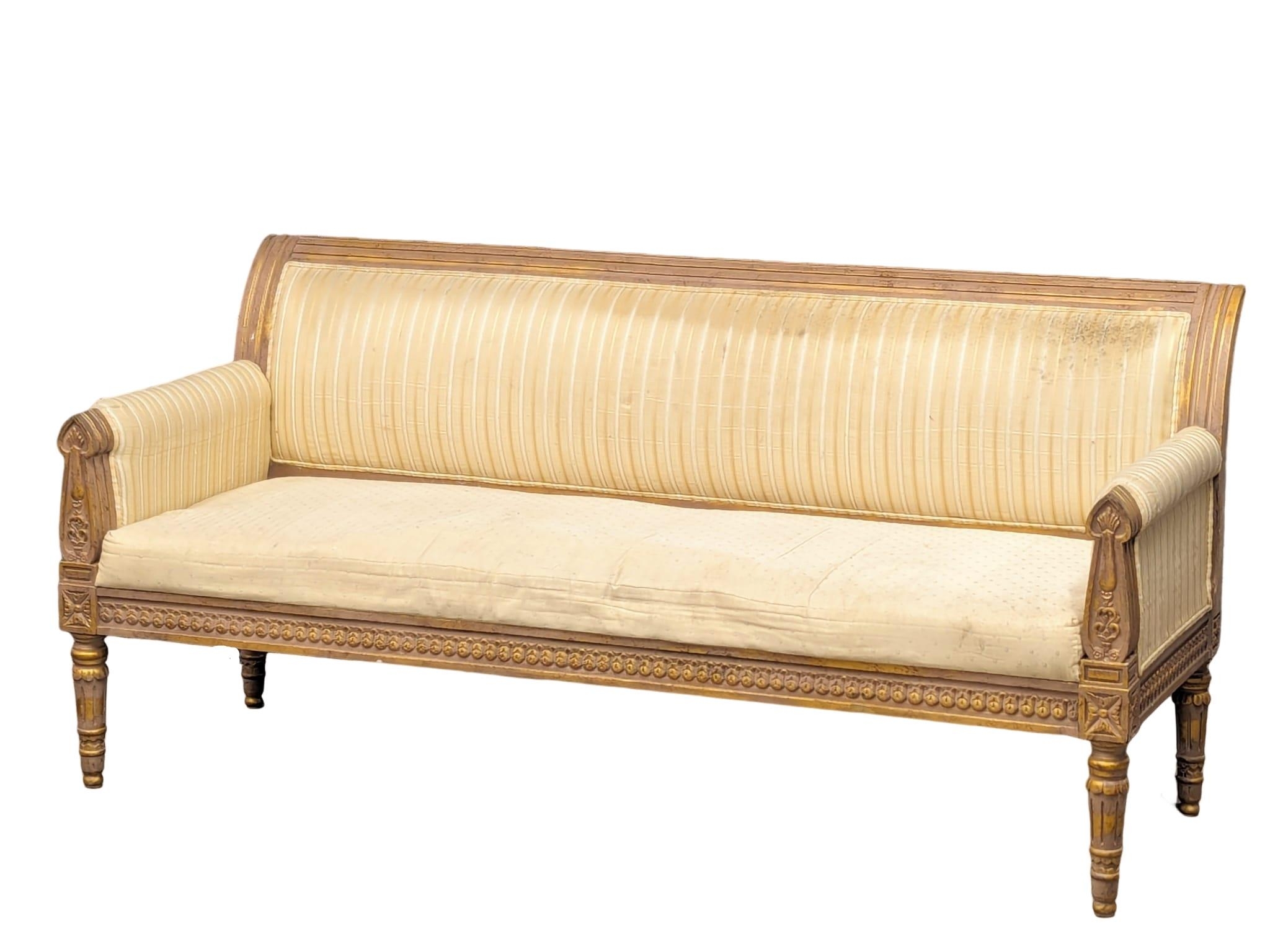 A 18th Century style French gilt framed 3 seater sofa / bench. 187cm