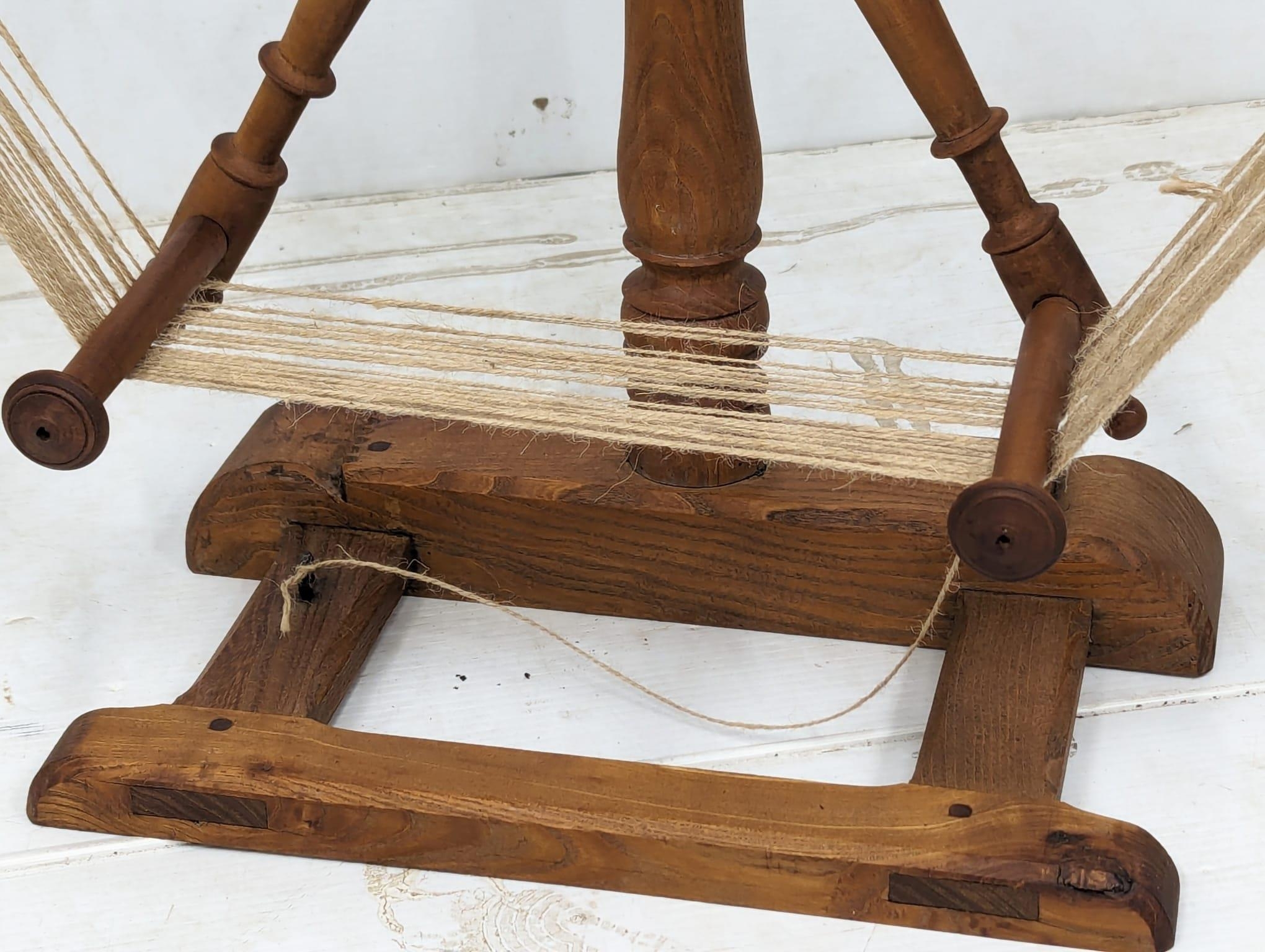 An Early 20th Century skein winder and a floor standing distaff. 69x79cm - Image 5 of 5