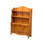 A yew wood open bookcase with 2 door cupboard. 84x26x120cm