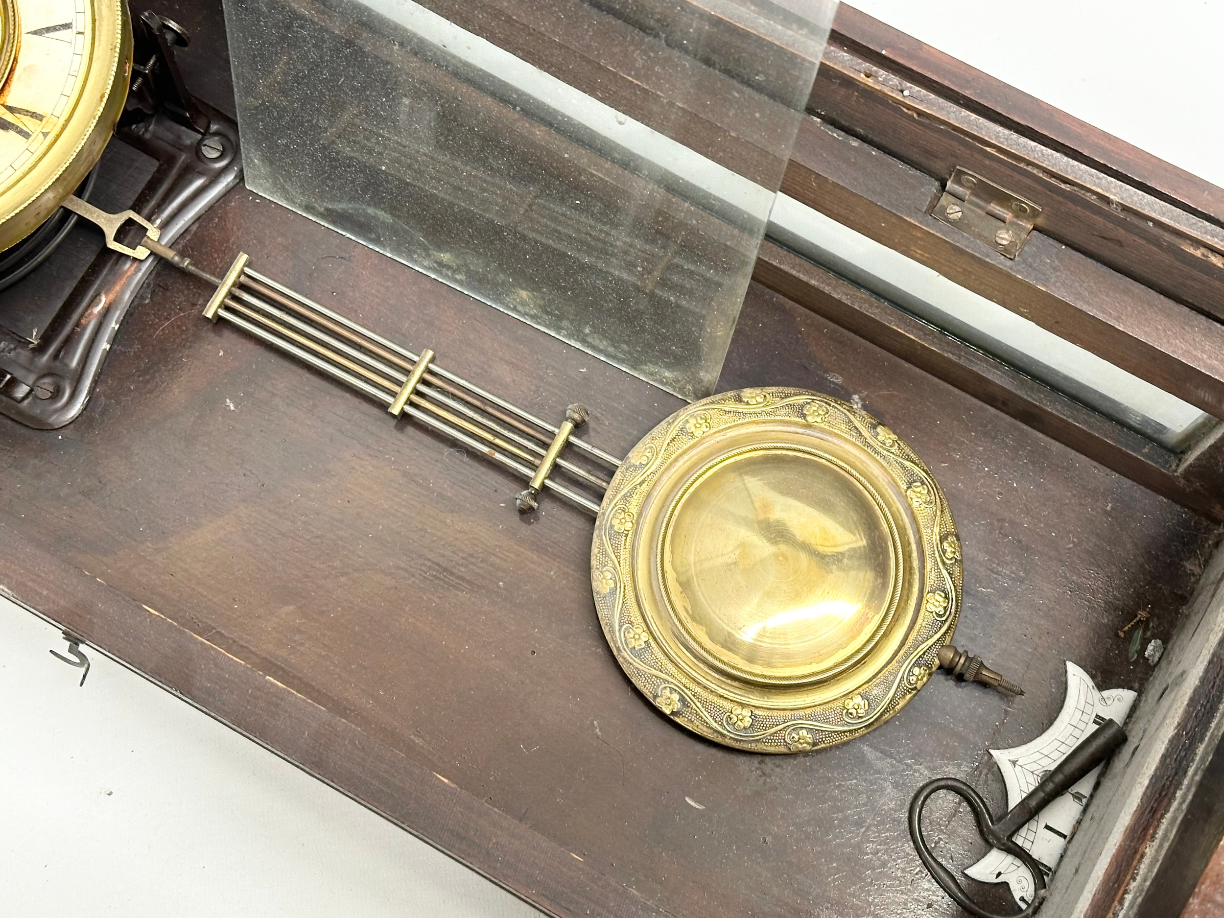 A Late 19th Century Victorian mahogany Vienna wall clock. With key and pendulum. 42x64cm - Image 5 of 5