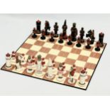 A medieval style chess set. 38x38cm