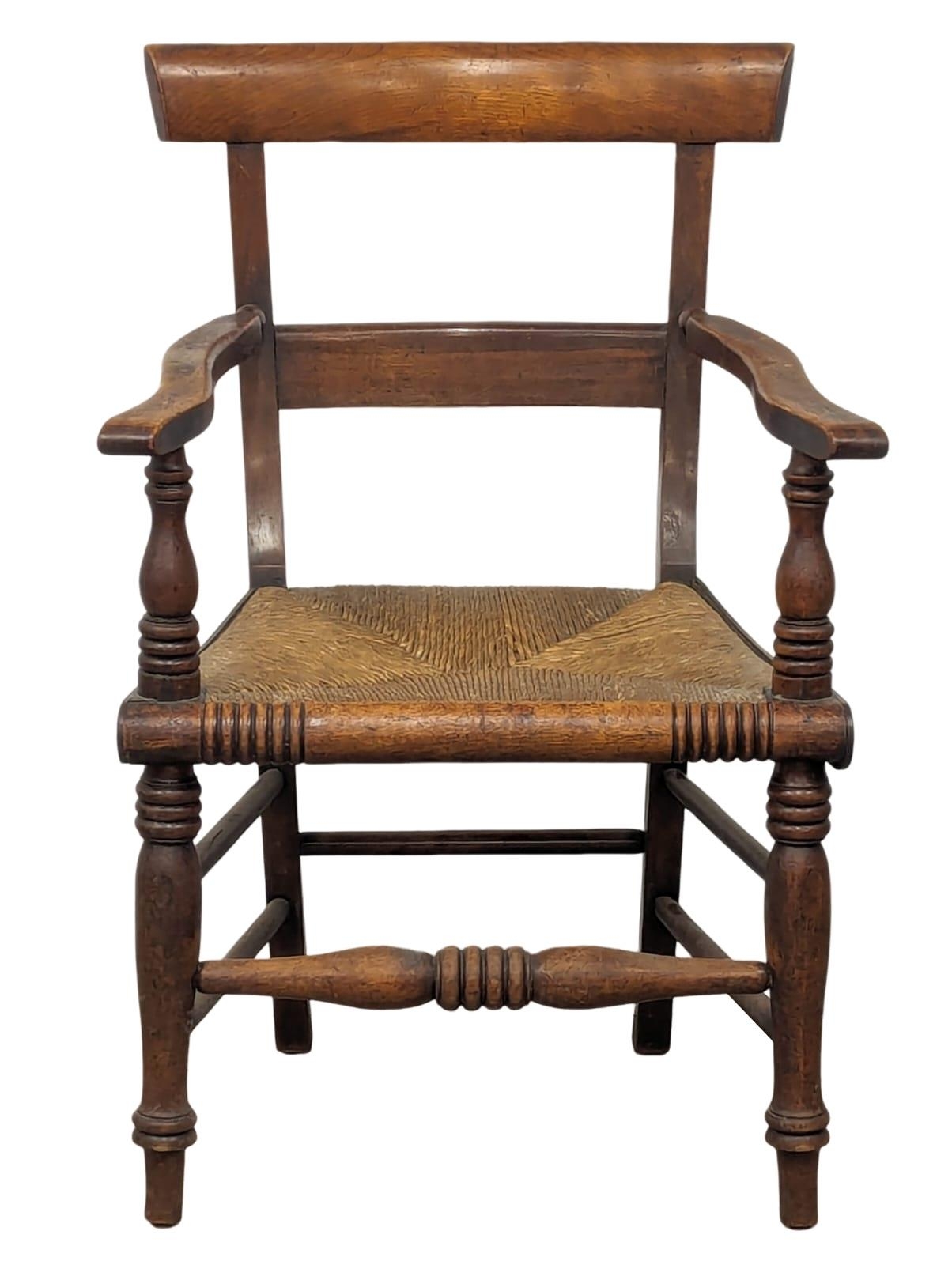 A mid 19th Century Scottish country house armchair with rush seat