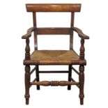 A mid 19th Century Scottish country house armchair with rush seat