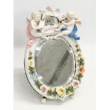 A Late 19th Century German porcelain framed dressing mirror. 21x32cm