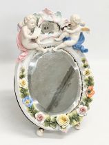 A Late 19th Century German porcelain framed dressing mirror. 21x32cm