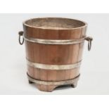 A large Late 19th Century oak coal bucket with large drop ring handles. Circa 1880-1900. 53x45x43.
