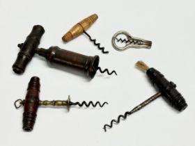 A good collection of 19th Century corkscrews with turned handles. A large barrel shaped corkscrew