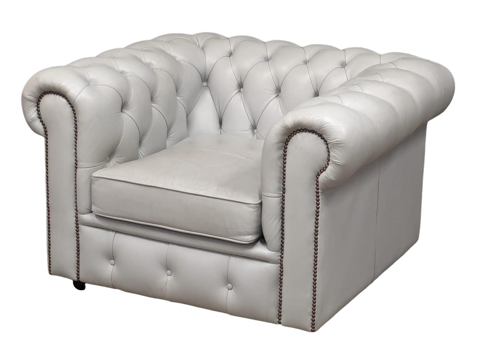 A deep button club style armchair