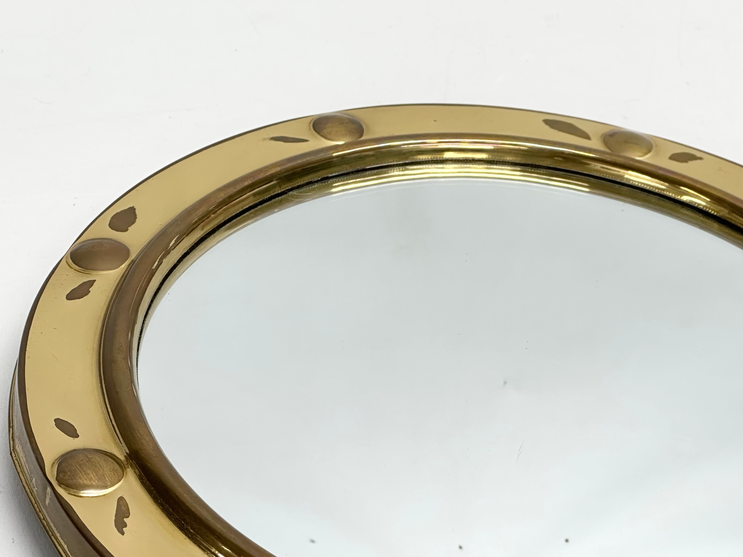 A Mid 20th Century brass framed ships porthole style convex mirror. 30cm - Image 3 of 4