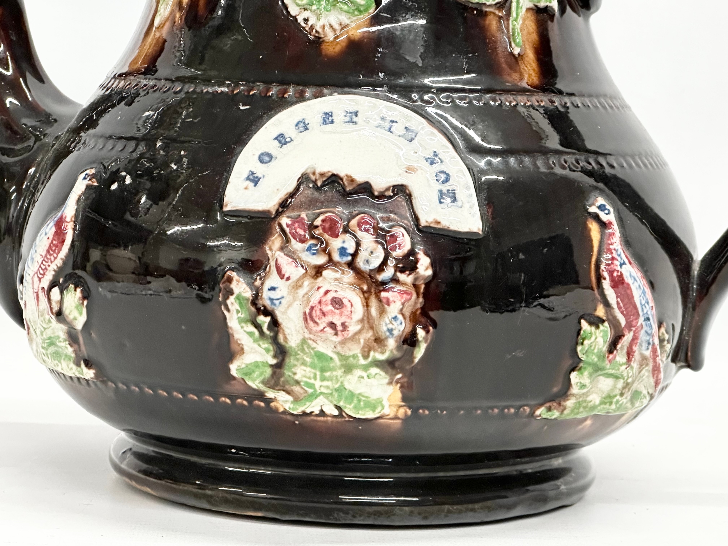 A large Late 19th Century Measham Pottery ‘Bargeware’ teapot. Circa 1880-1890. Forget Me Not. - Image 4 of 8