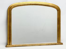 A Victorian style gilt framed over-mantle mirror. 97x73cm