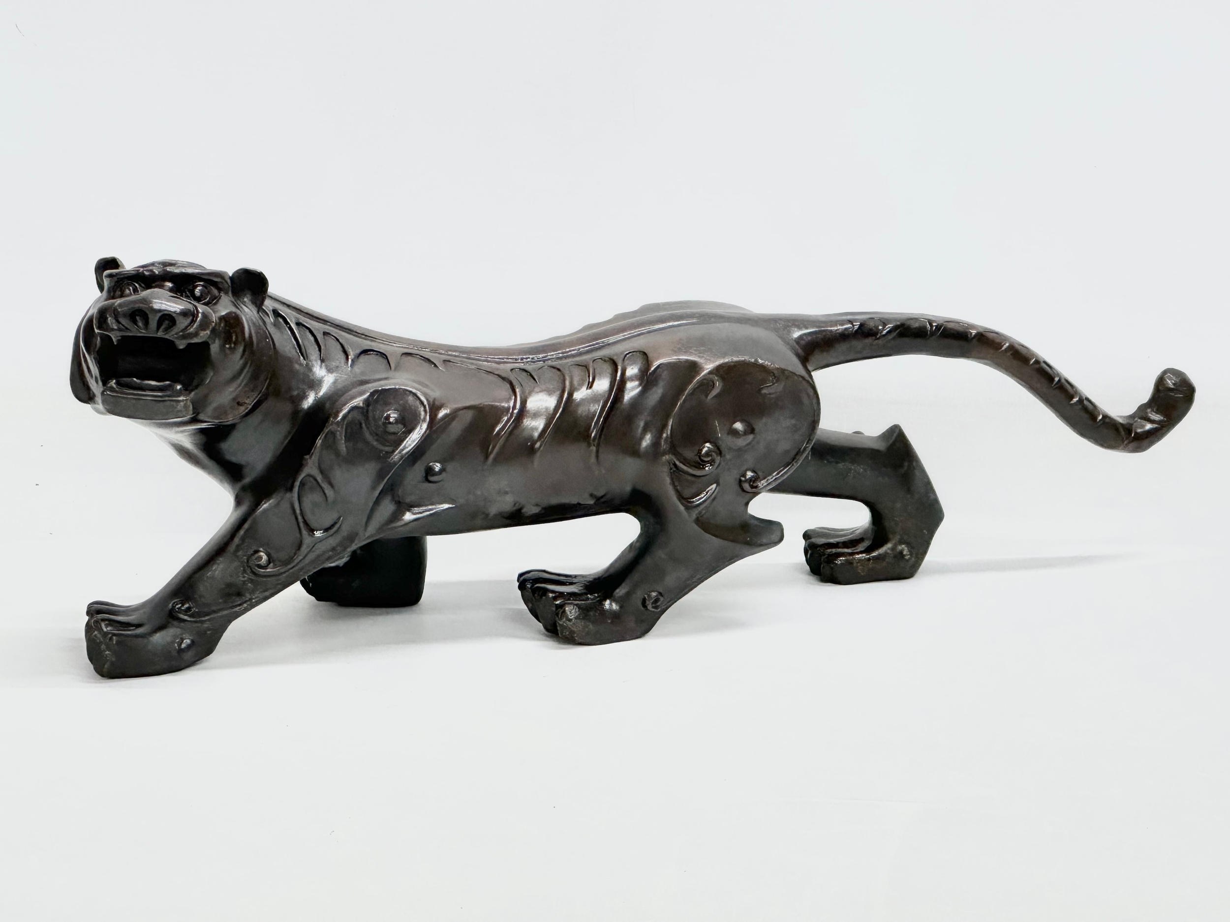 An Early 20th Century Chinese Feng Shui bronze Evil and Wealth Tiger. 38cm