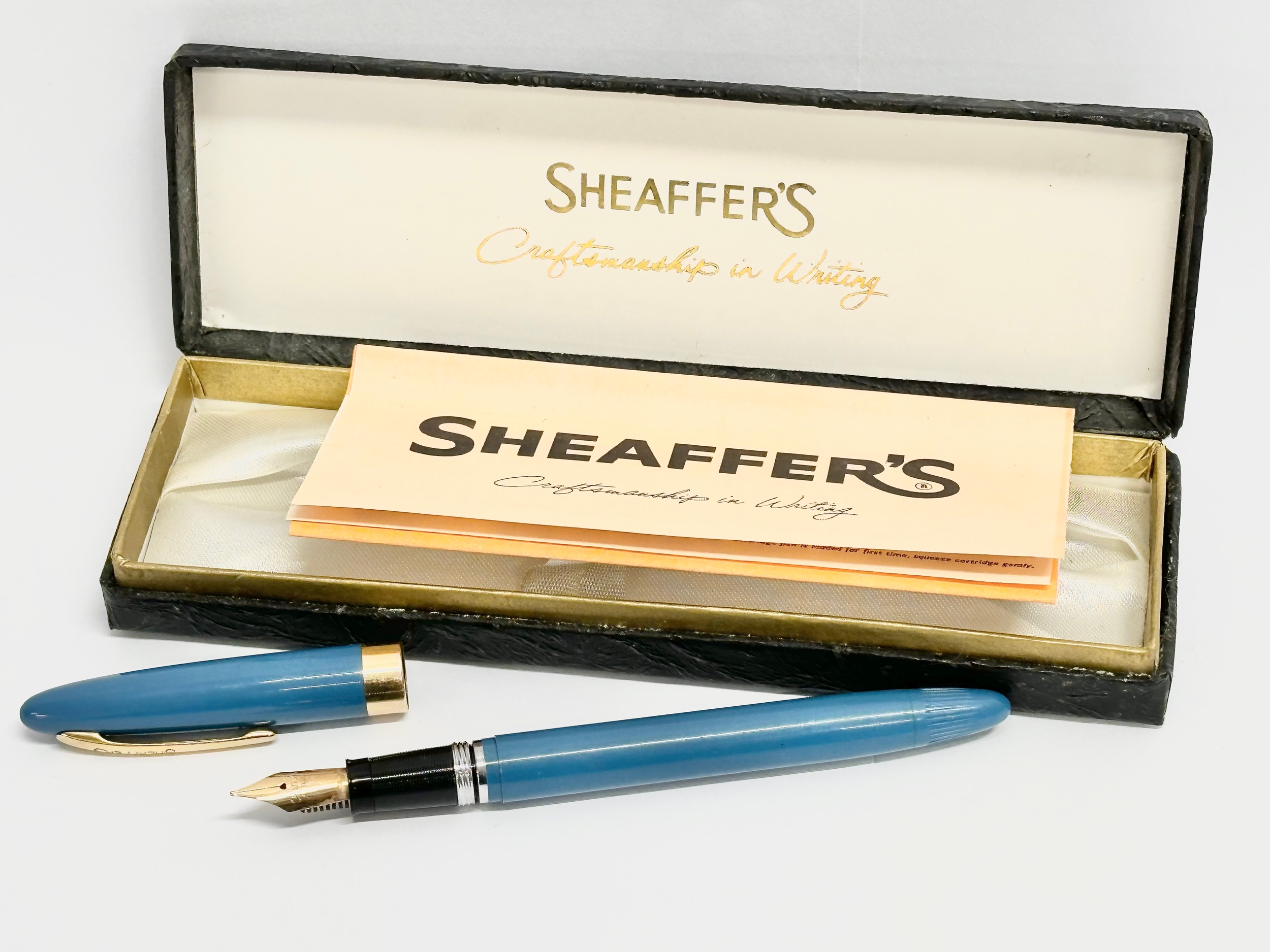 A 14k gold nip fountain pen by Sheaffer’s.