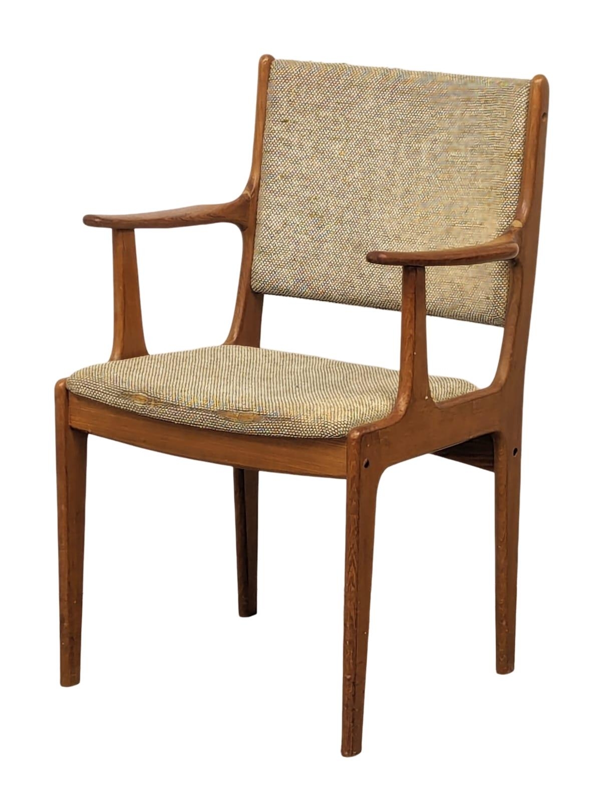 A Danish Mid Century teak armchair designed by Johannes Andersen.