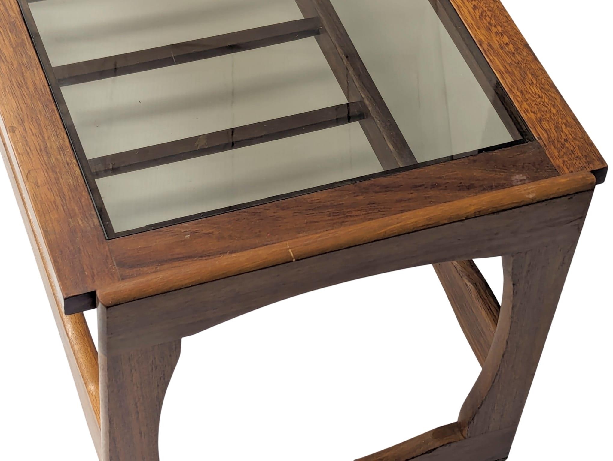 A Mid Century teak and glass top coffee table. 121x47.5x43.5cm - Image 2 of 5