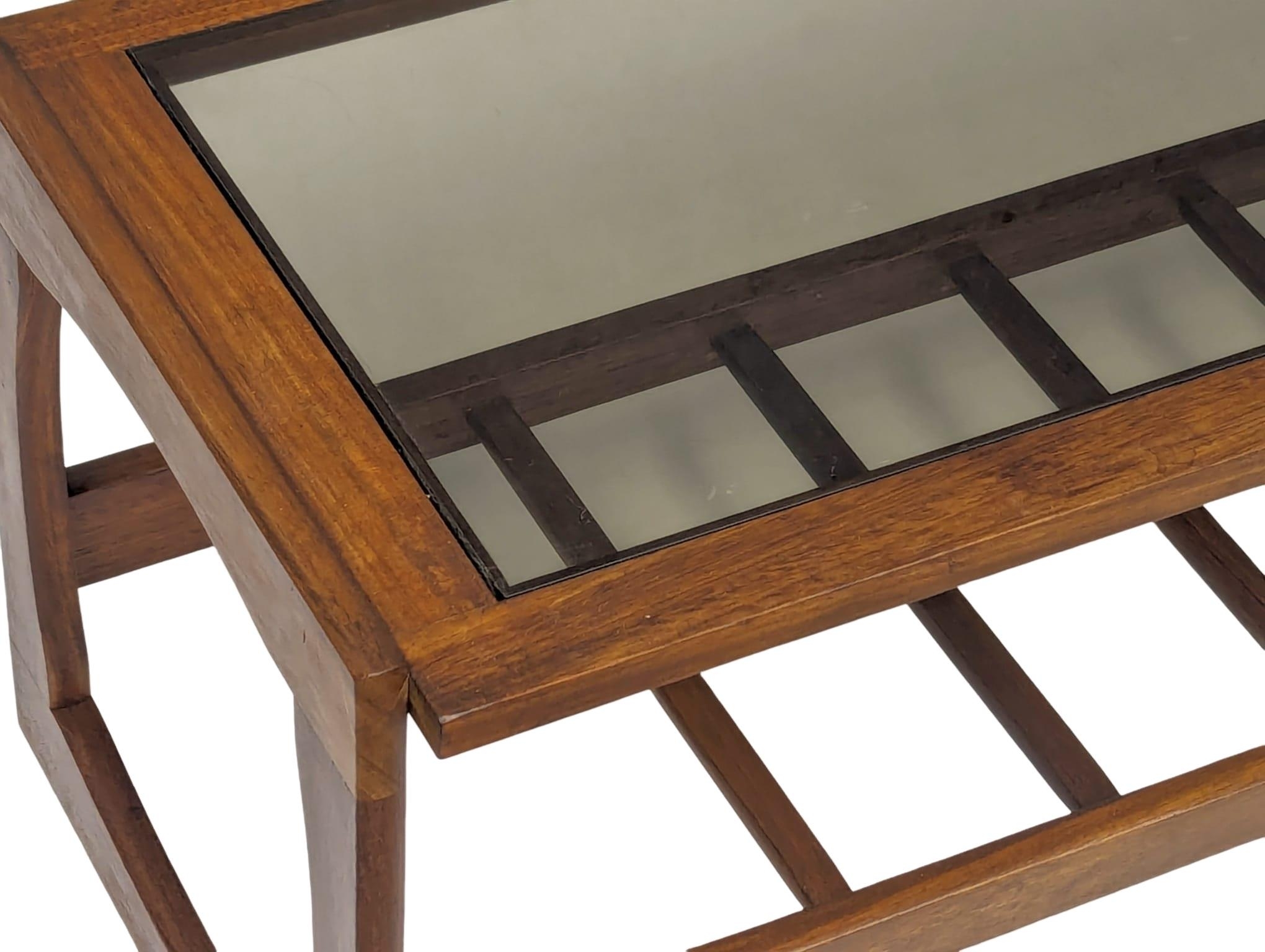 A Mid Century teak and glass top coffee table. 121x47.5x43.5cm - Image 4 of 5