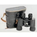 A pair of binoculars with case by Tecnar.