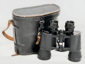 A pair of binoculars with case by Tecnar.