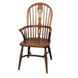 A large Windsor style elbow chair in oak and beech.