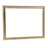 A large gilt framed bevelled mirror. 103x88cm