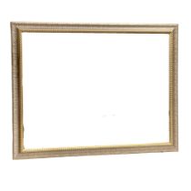 A large gilt framed bevelled mirror. 103x88cm