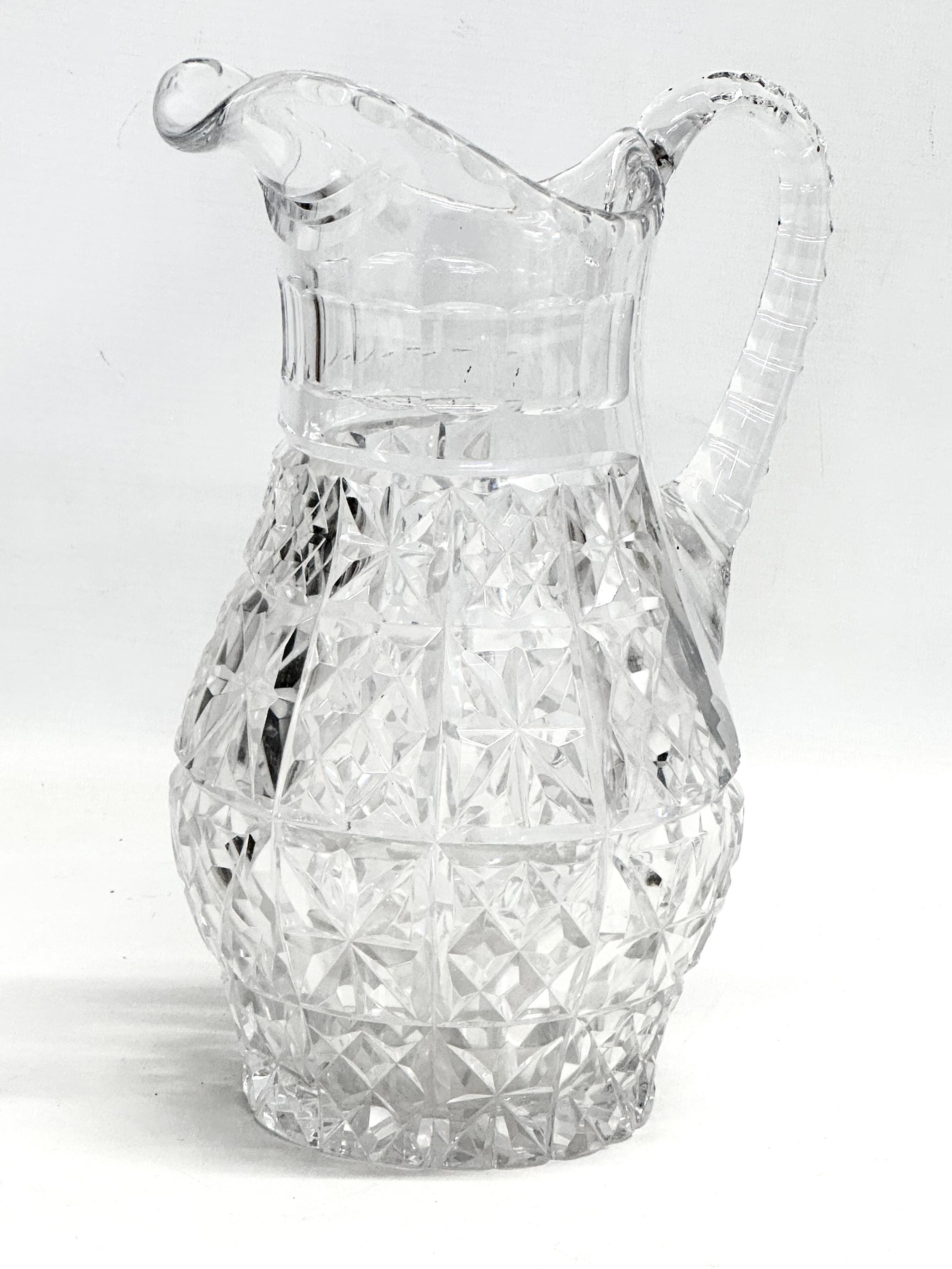 A Late 19th Century Victorian cut glass water jug. Circa 1890-1900. 26cm