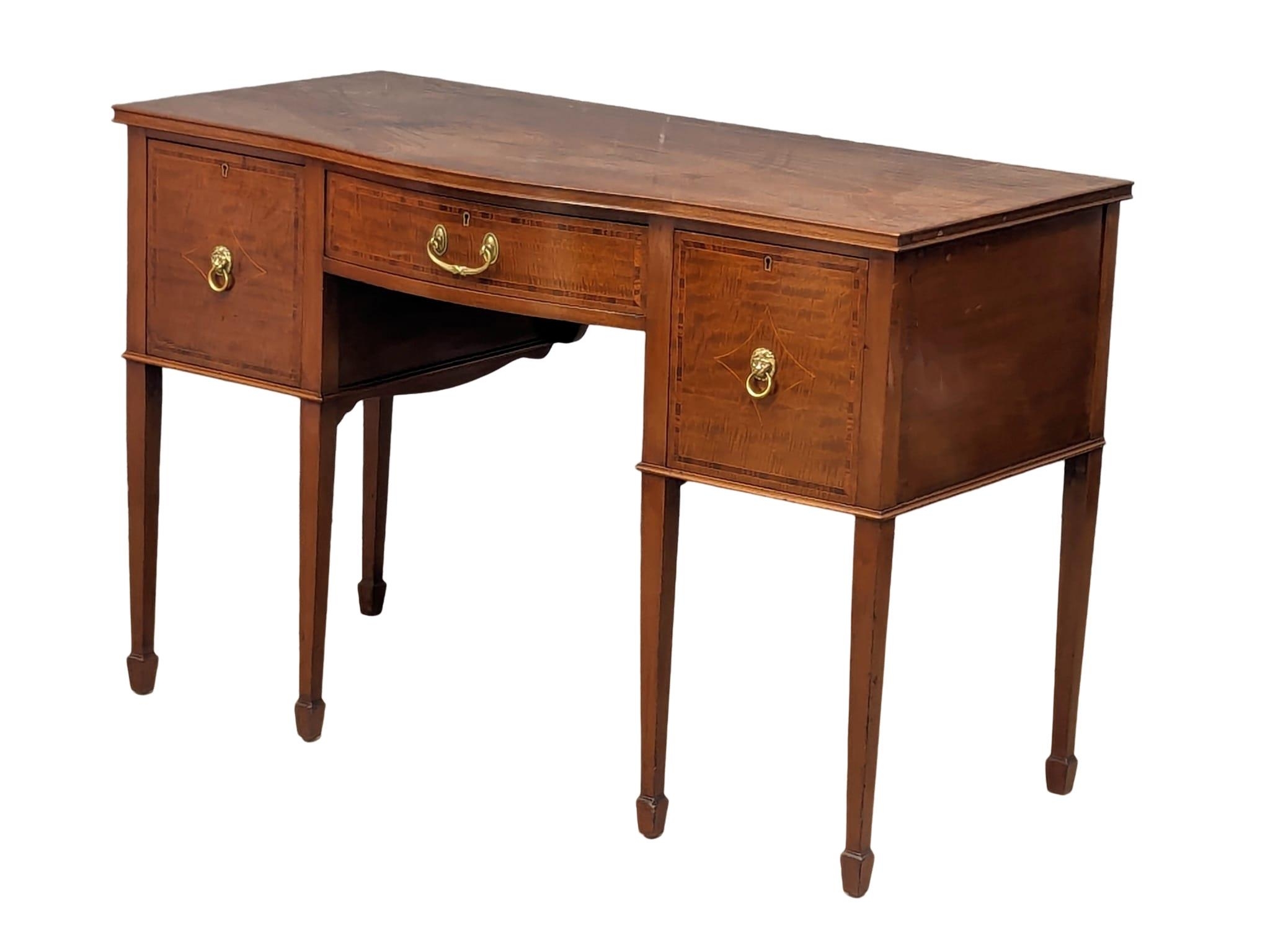 An Early 20th Century Sheraton Revival inlaid mahogany Serpentine front desk / side table. 122x57.