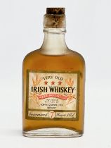 A bottle of vintage Very Old Irish Whiskey. Bottled by John Quinn LTD, Newry. 70 proof.
