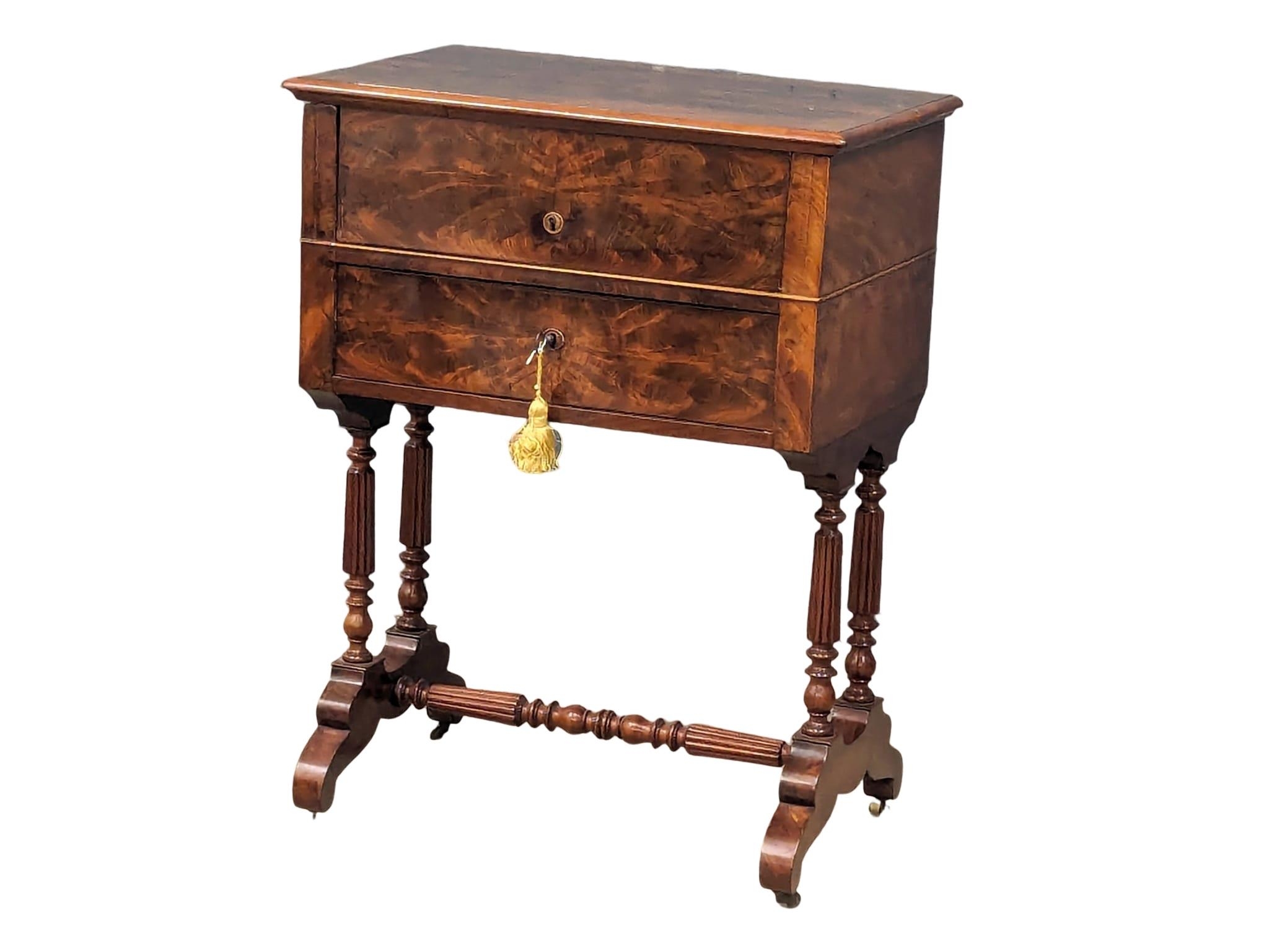 A 19th Century French mahogany washstand / dressing table on reeded turned legs and stretcher. Circa