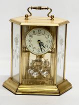 A 20th century German brass Anniversary clock by Benchmark. 21x15x22cm