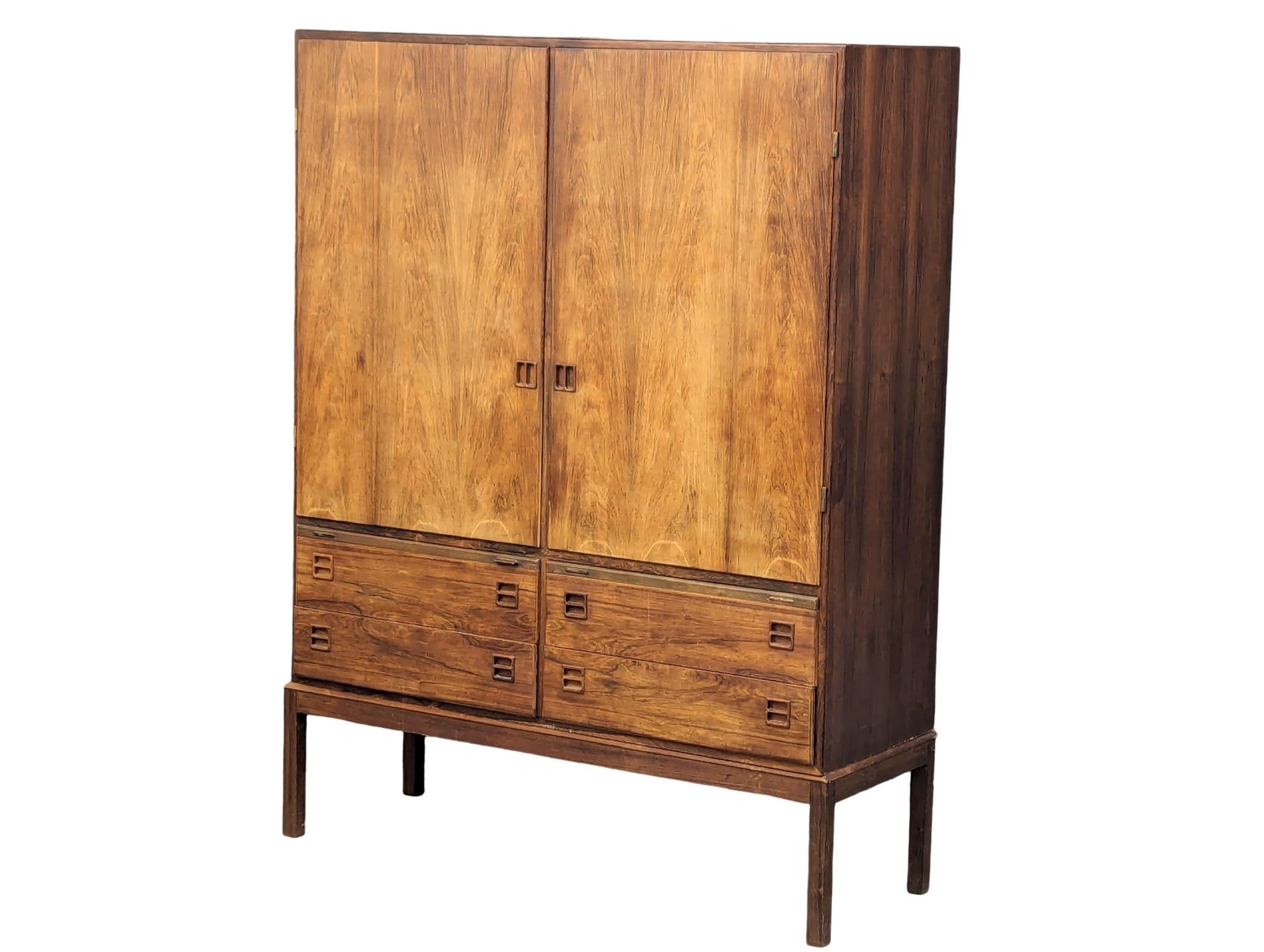 A Danish Mid Century rosewood cabinet designed by Johannes Andersen for Bernhard Pedersen & Son,